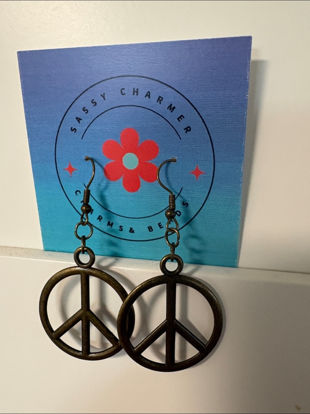 Bronze Peace Sign Dangle Earrings - Sassy Charmer
